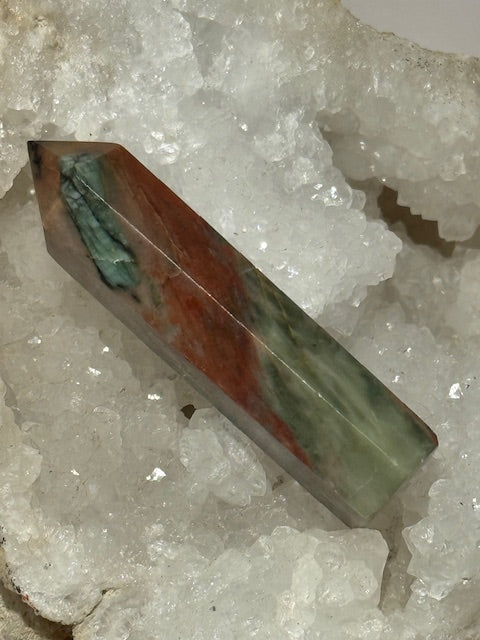 Green emerald point with bixbite (red emerald) inclusions