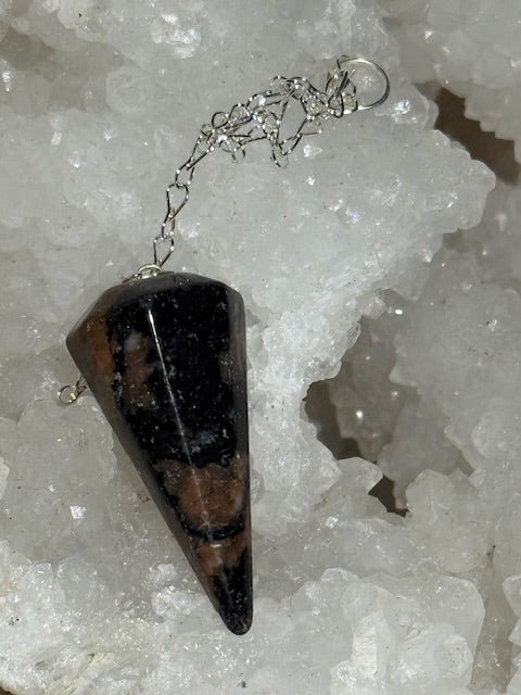 Green emerald pendulum with bixbite (red emerald) inclusions
