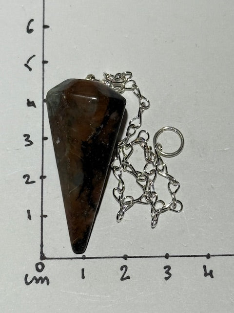 Green emerald pendulum with bixbite (red emerald) inclusions