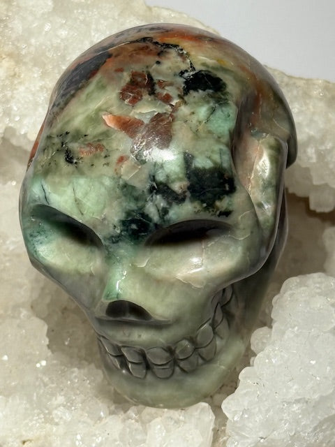 Green emerald skull with bixbite (red emerald) inclusions